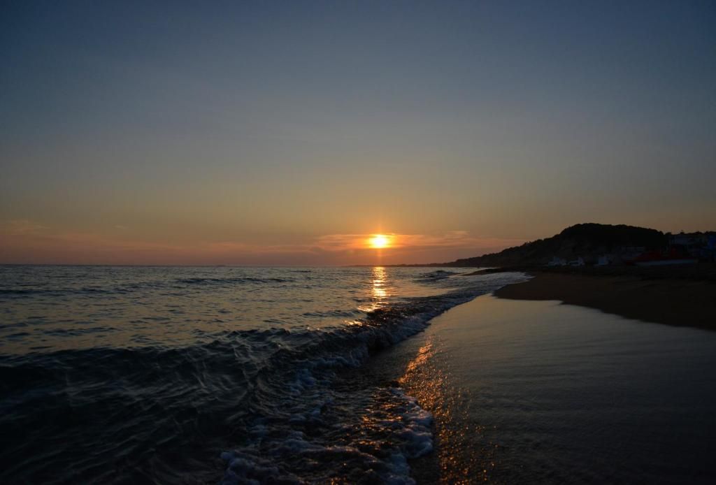 Sunset over the sea at Marathias Beach, Southern Corfu